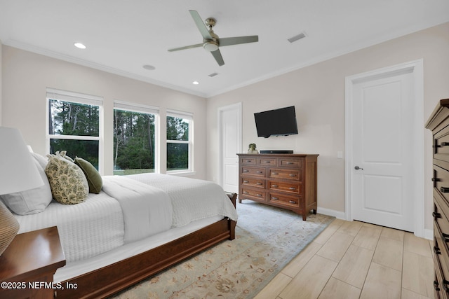 bedroom with baseboards, visible vents, crown molding, and recessed lighting