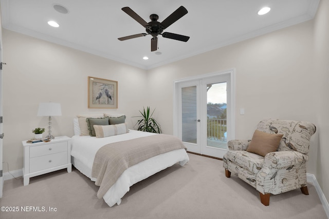 carpeted bedroom featuring access to outside, baseboards, and crown molding