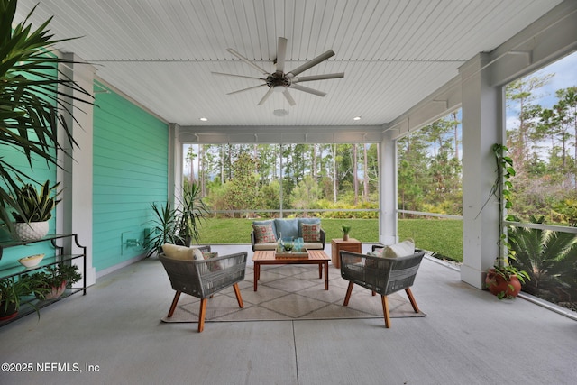 sunroom with a ceiling fan