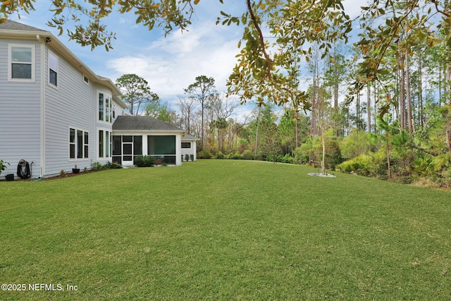 view of yard with a sunroom