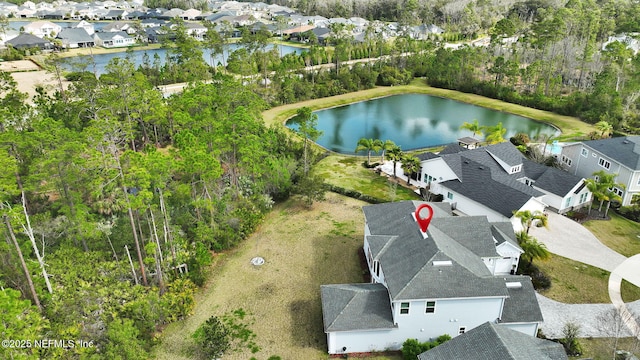 bird's eye view with a water view and a residential view