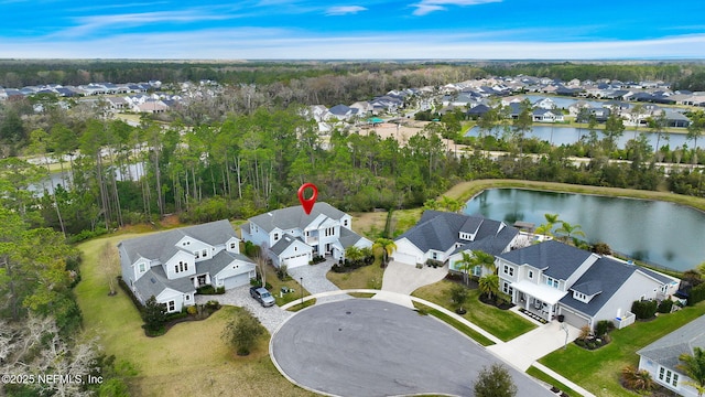 aerial view featuring a water view and a residential view