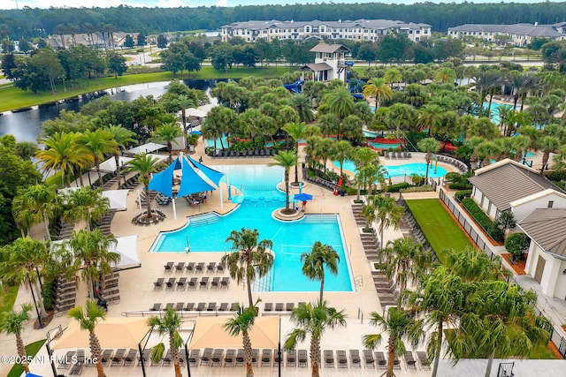 birds eye view of property with a water view