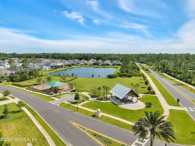 drone / aerial view featuring a residential view and a water view