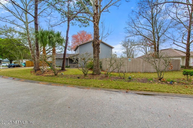 view of property exterior with fence