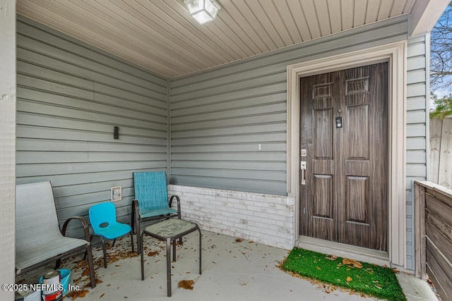 doorway to property with a patio area