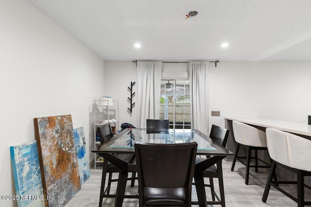 dining area featuring recessed lighting and light wood finished floors