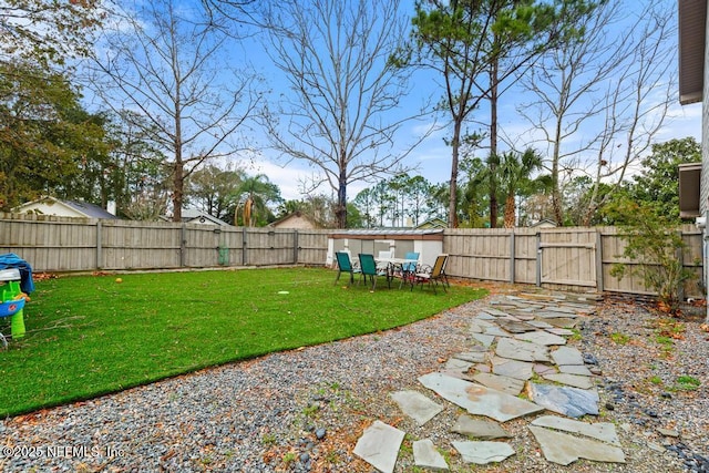 view of yard with a fenced backyard