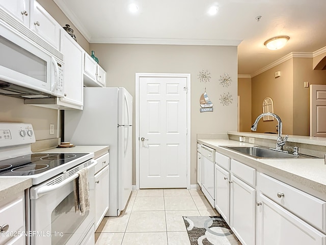 kitchen with light tile patterned flooring, white appliances, a sink, white cabinets, and ornamental molding