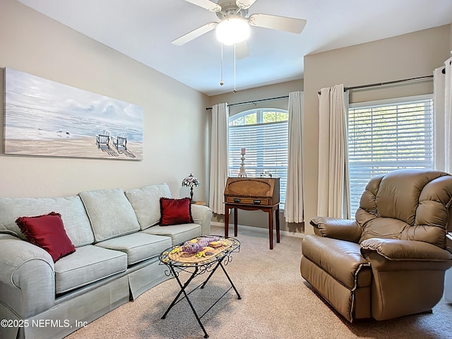 living room with carpet floors and a ceiling fan