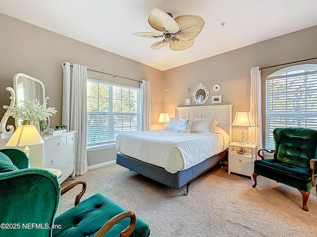 bedroom featuring ceiling fan, carpet flooring, and baseboards