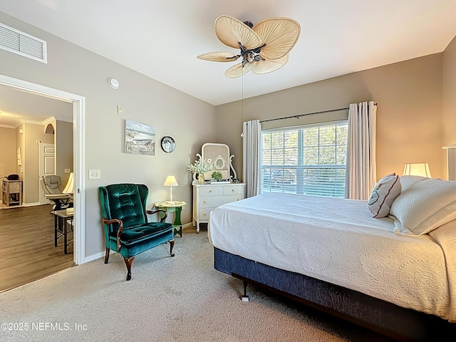 bedroom with a ceiling fan, carpet, visible vents, and baseboards