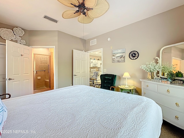 bedroom featuring a ceiling fan, visible vents, and connected bathroom