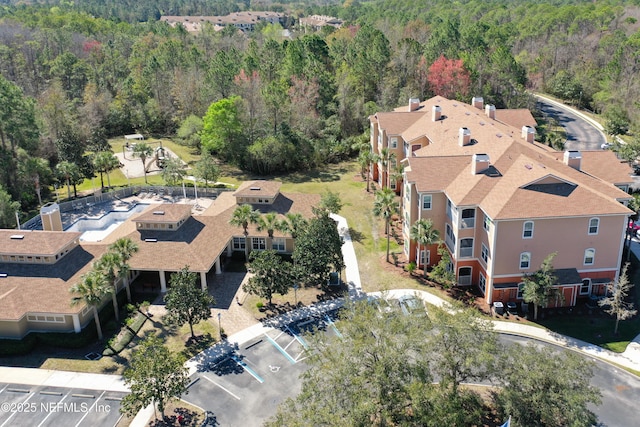 drone / aerial view with a view of trees