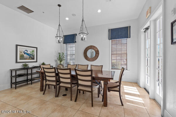 dining room with light tile patterned floors, visible vents, and recessed lighting