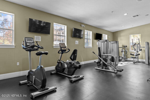 workout area with visible vents and baseboards