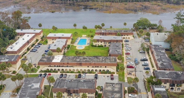 birds eye view of property with a water view