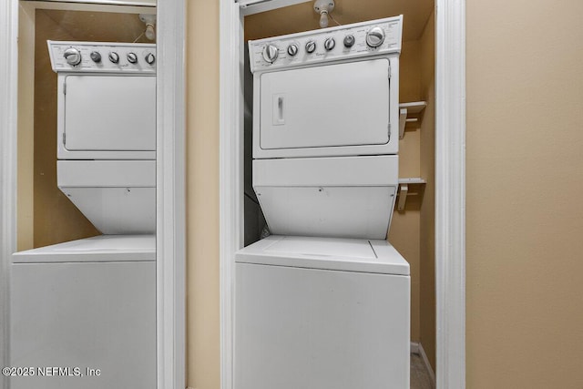 washroom featuring laundry area and stacked washing maching and dryer