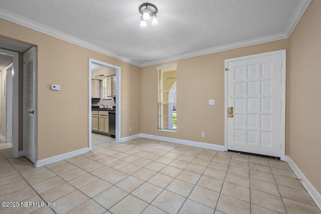 foyer entrance with light tile patterned floors, a textured ceiling, baseboards, and crown molding