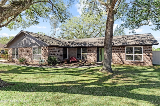 596 Rockingham Rd, Orange Park, FL 32073 - view of front of property featuring a front lawn and brick siding