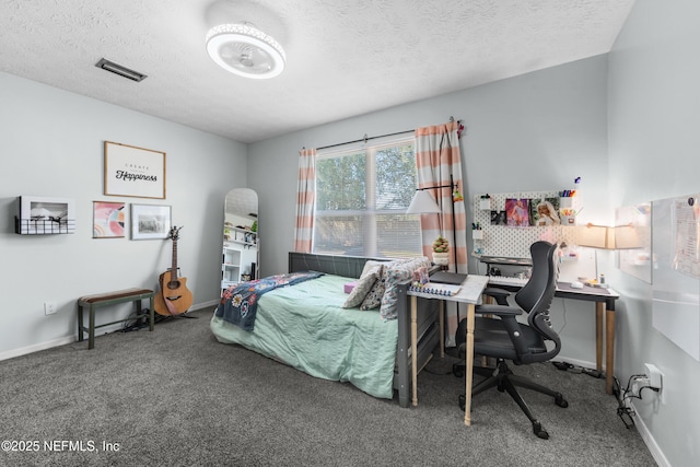 bedroom featuring a textured ceiling, carpet, visible vents, and baseboards