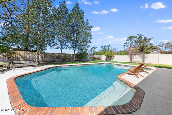 view of pool with a fenced in pool, a patio area, and a fenced backyard