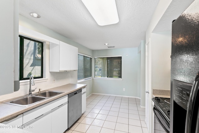 kitchen featuring black appliances, a sink, white cabinetry, light countertops, and light tile patterned floors