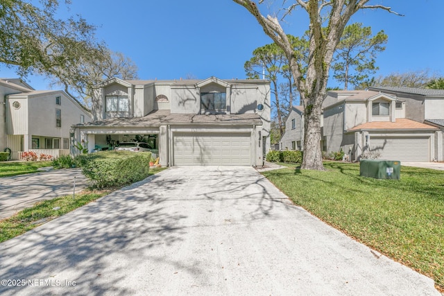 view of front of property featuring concrete driveway, an attached garage, a front yard, and stucco siding