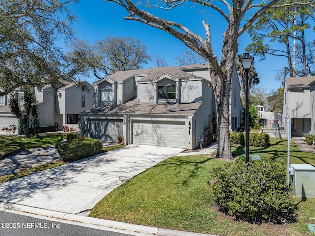 view of front of property with a front lawn, a residential view, concrete driveway, stucco siding, and a garage