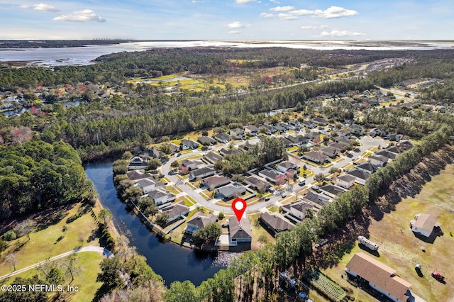 drone / aerial view featuring a residential view and a water view