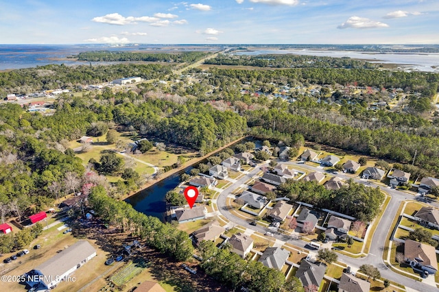 birds eye view of property featuring a residential view and a water view