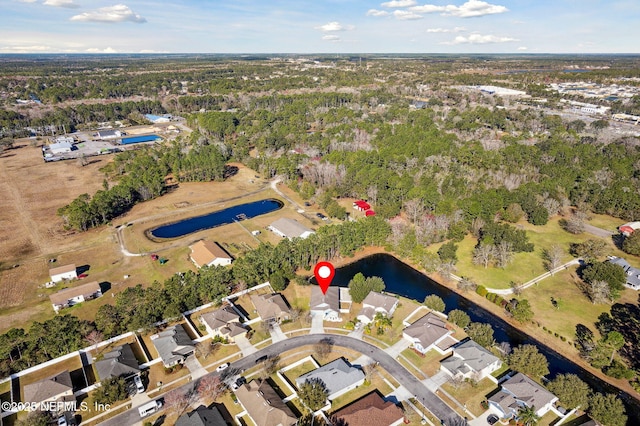 aerial view with a residential view and a water view