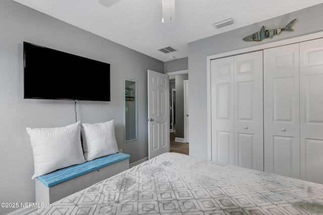 bedroom featuring visible vents, a closet, and a ceiling fan