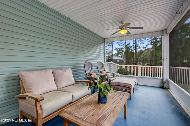 sunroom featuring ceiling fan