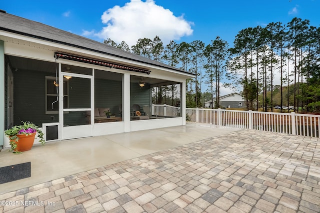 view of patio / terrace with a sunroom