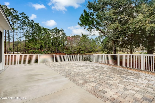 view of patio / terrace featuring fence