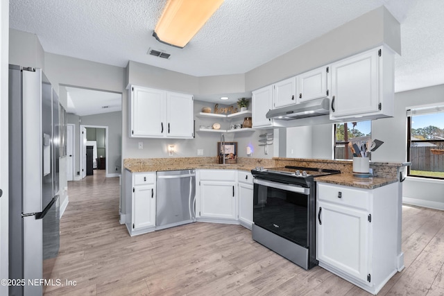 kitchen featuring stainless steel appliances, white cabinets, visible vents, and under cabinet range hood