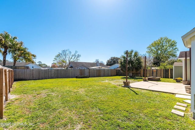 view of yard featuring a fenced backyard and a patio