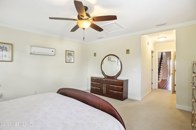 bedroom with light colored carpet, a wall mounted AC, ornamental molding, attic access, and baseboards