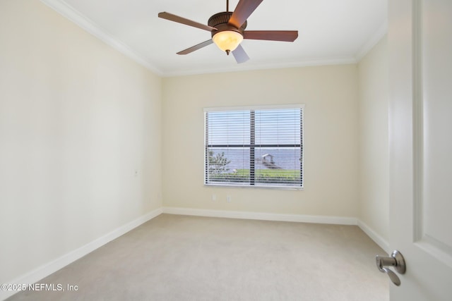 unfurnished room featuring light carpet, ornamental molding, and baseboards