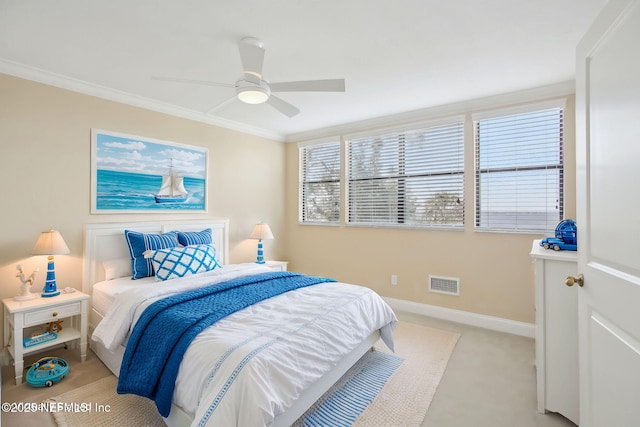 bedroom with ornamental molding, visible vents, light carpet, and baseboards