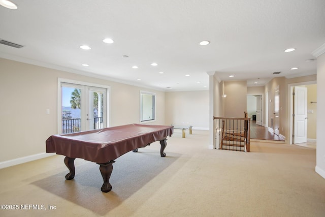 rec room with french doors, crown molding, recessed lighting, light colored carpet, and visible vents