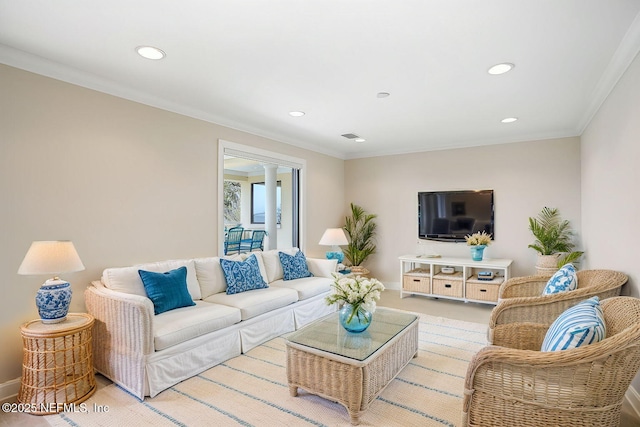 living room with ornamental molding, recessed lighting, and baseboards