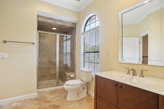 full bathroom featuring toilet, vanity, baseboards, ornamental molding, and a shower stall