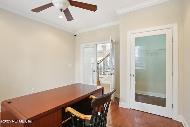 home office with dark wood-style floors, ceiling fan, ornamental molding, and baseboards