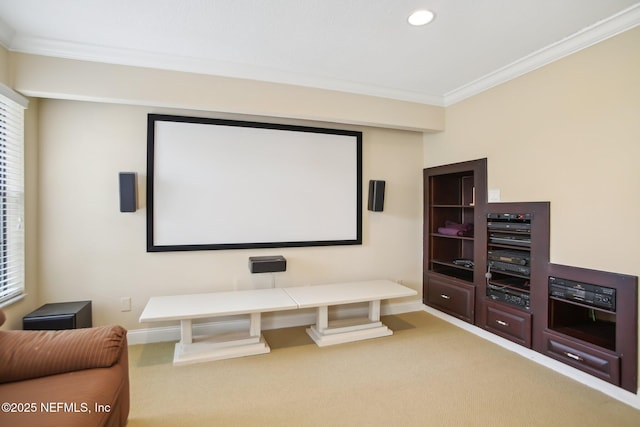 home theater room with recessed lighting, light colored carpet, crown molding, and baseboards