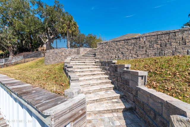 exterior details featuring stairway and fence