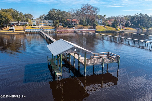 dock area with a water view and boat lift