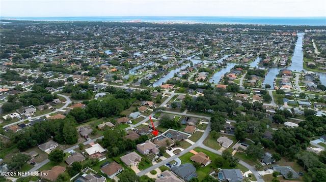 birds eye view of property featuring a water view and a residential view