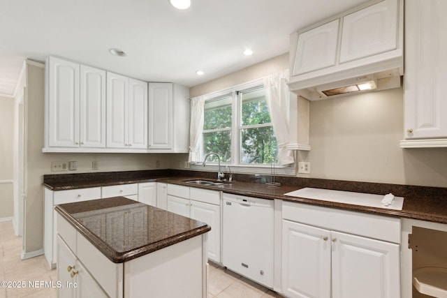 kitchen with light tile patterned flooring, recessed lighting, a sink, white cabinets, and dishwasher